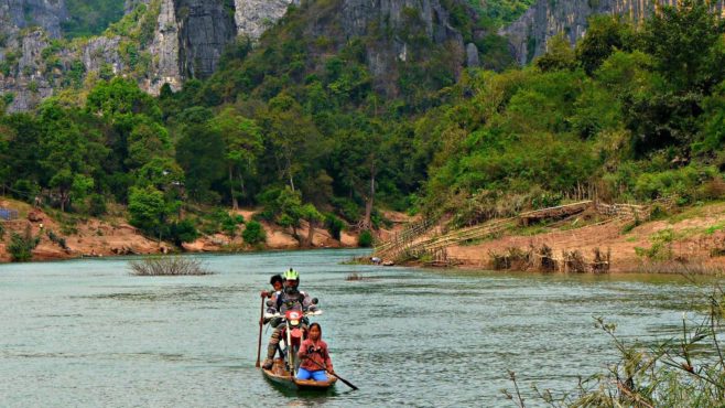 moto-crossing-river-on-ferry-historical-adventure-tour