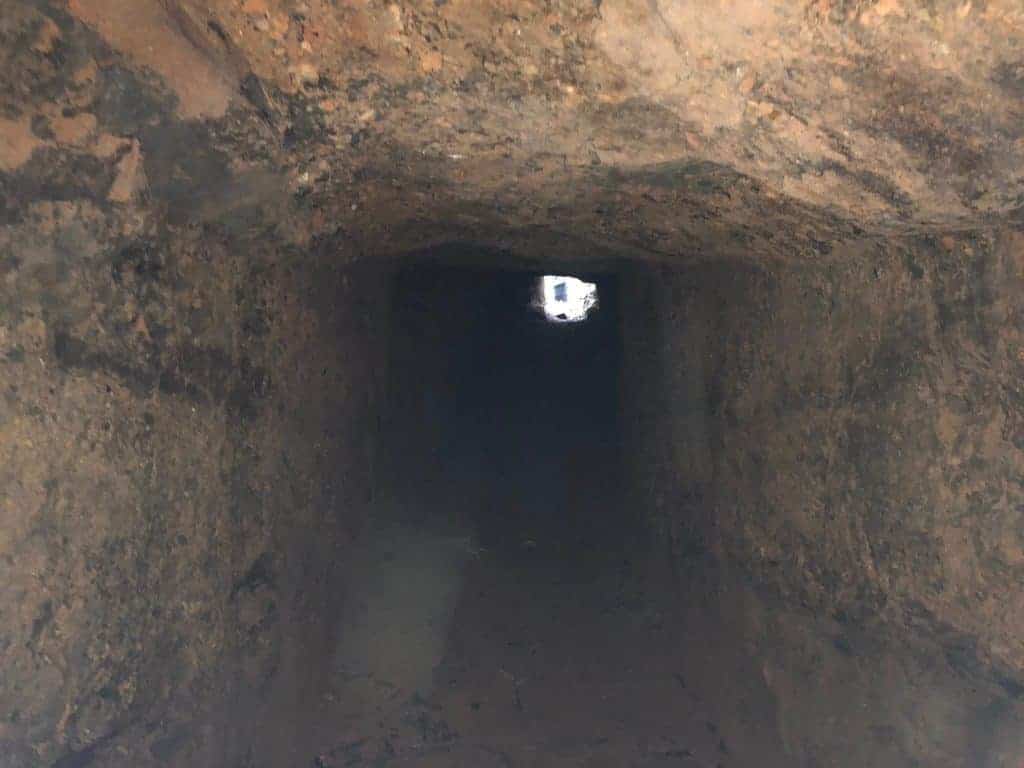 standing-inside-nva-tunnel-ho-chi-minh-trail-laos-xepon-area-looking-into-the-tunnel