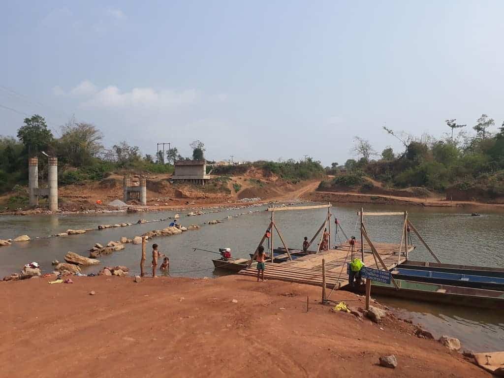 river-crossings-Laos-Ho-Chi-Minh-Trail-ferry-operational-bridge-damaged-by-water